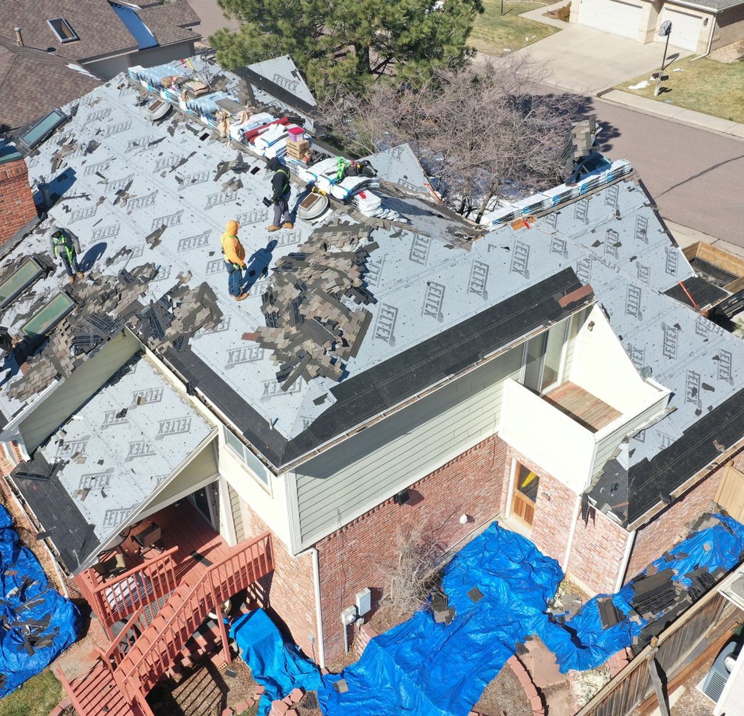 Steadfast Construction crew during a roof tear-off in Douglas County